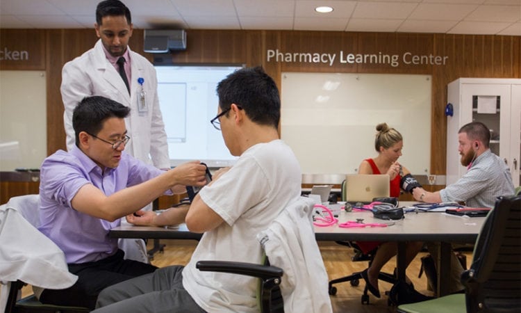 UW student pharmacists train in our Bracken Pharmacy Learning Center lab