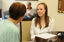 Alumna Laura Hart, PharmD, meets with a patient