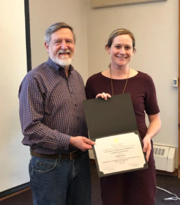 Lou Garrison presents the Garrison Prize to Lizzy Brouwer at the 2019 CHOICE retreat.