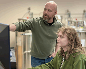 Dale Whittington and Medicinal Chemistry graduate student, Corrina Cooper observinf Instrument.