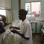 Pharmacy Assistant student attending to patients during practicum training in rural pharmacies in Malawi