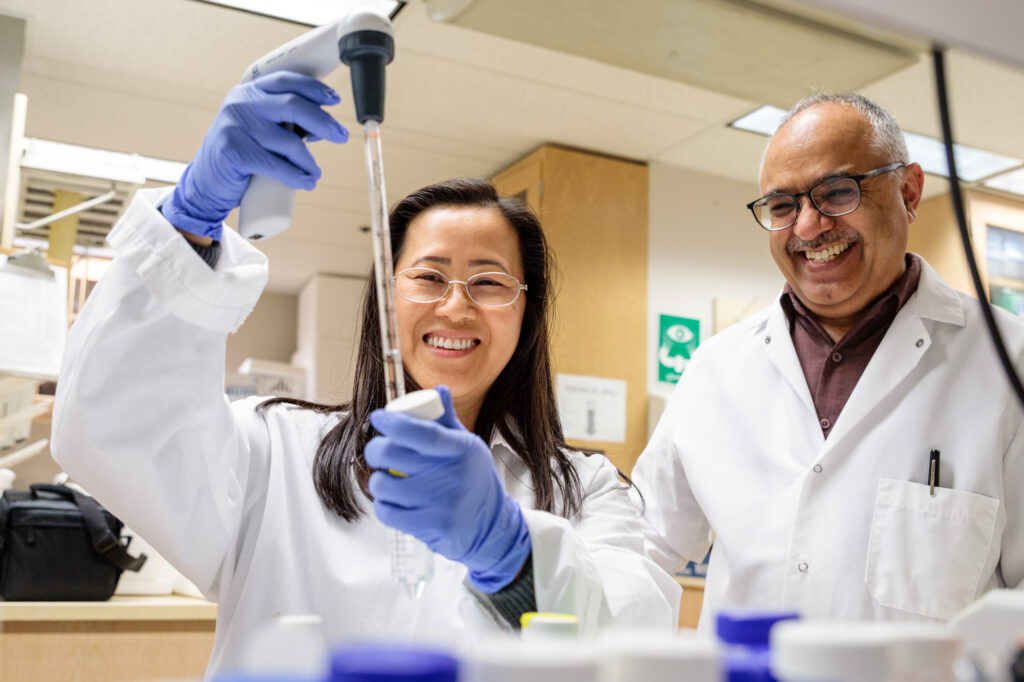 Jash and Grad Student in Lab