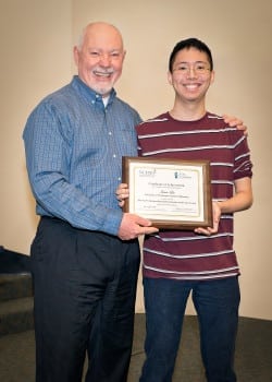 I2P2 Endowed Clinical Professor Don Downing presents the NCPA Student Member of the Year award to James Lin